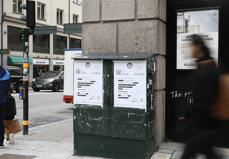 Pedestrian engaging with The Mauritanian classified poster